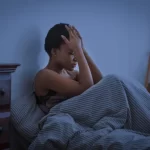 Cognitive Hypnotherapist Explains the Root Cause of ‘Tired But Wired’ Feeling — And What Can Help